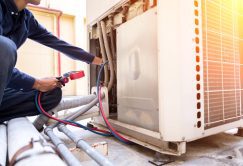Technician is checking air conditioner ,measuring equipment for filling air conditioners. Technician is checking air conditioner ,measuring equipment for filling air conditioners.